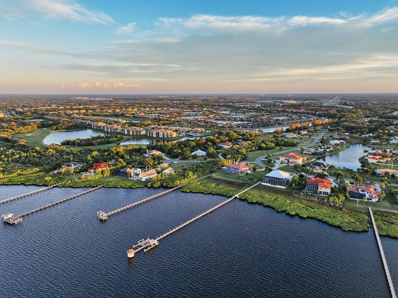 Golden hour aerial of bayfront docks